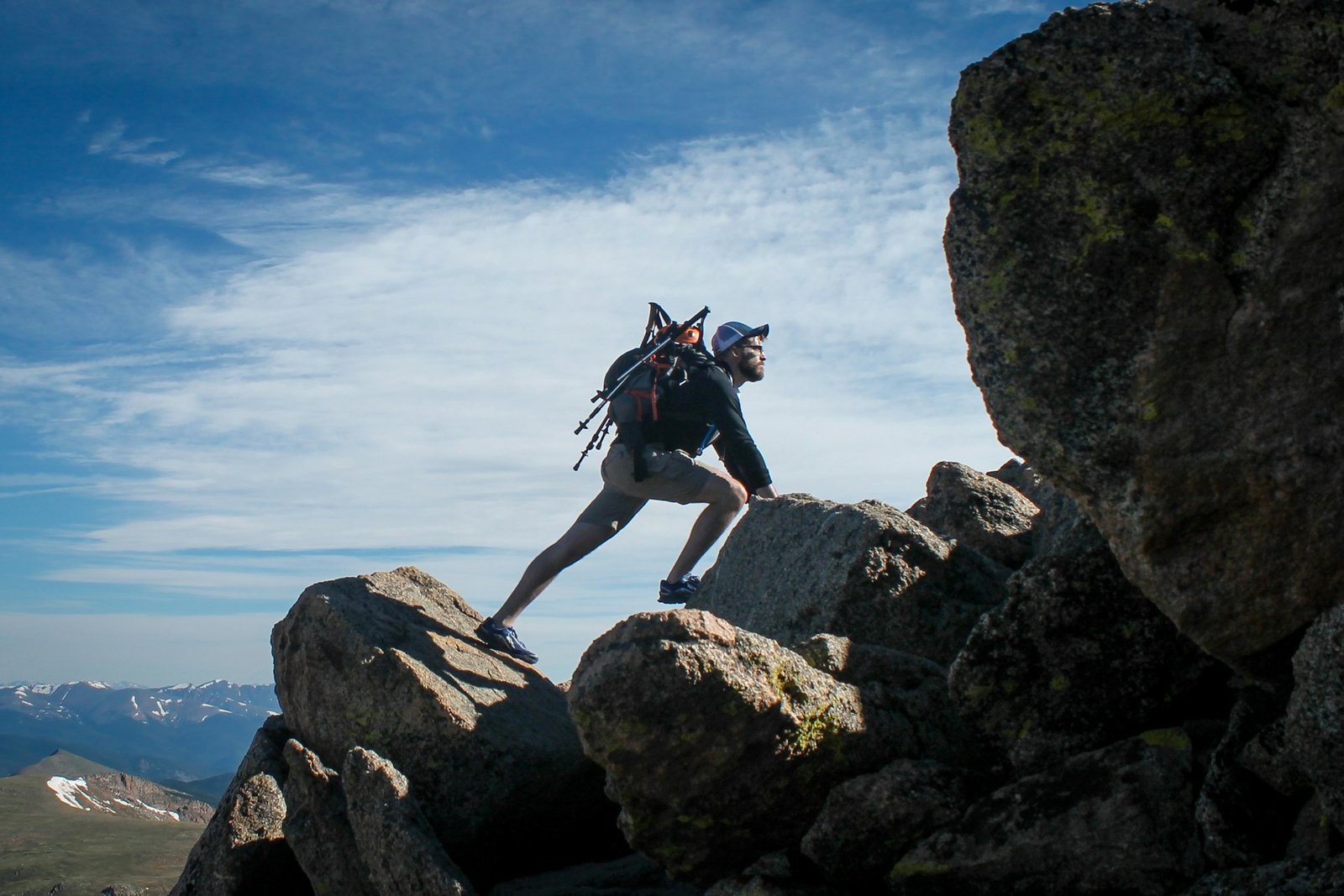 photo of man climbing mountain photo of man climbing mountain